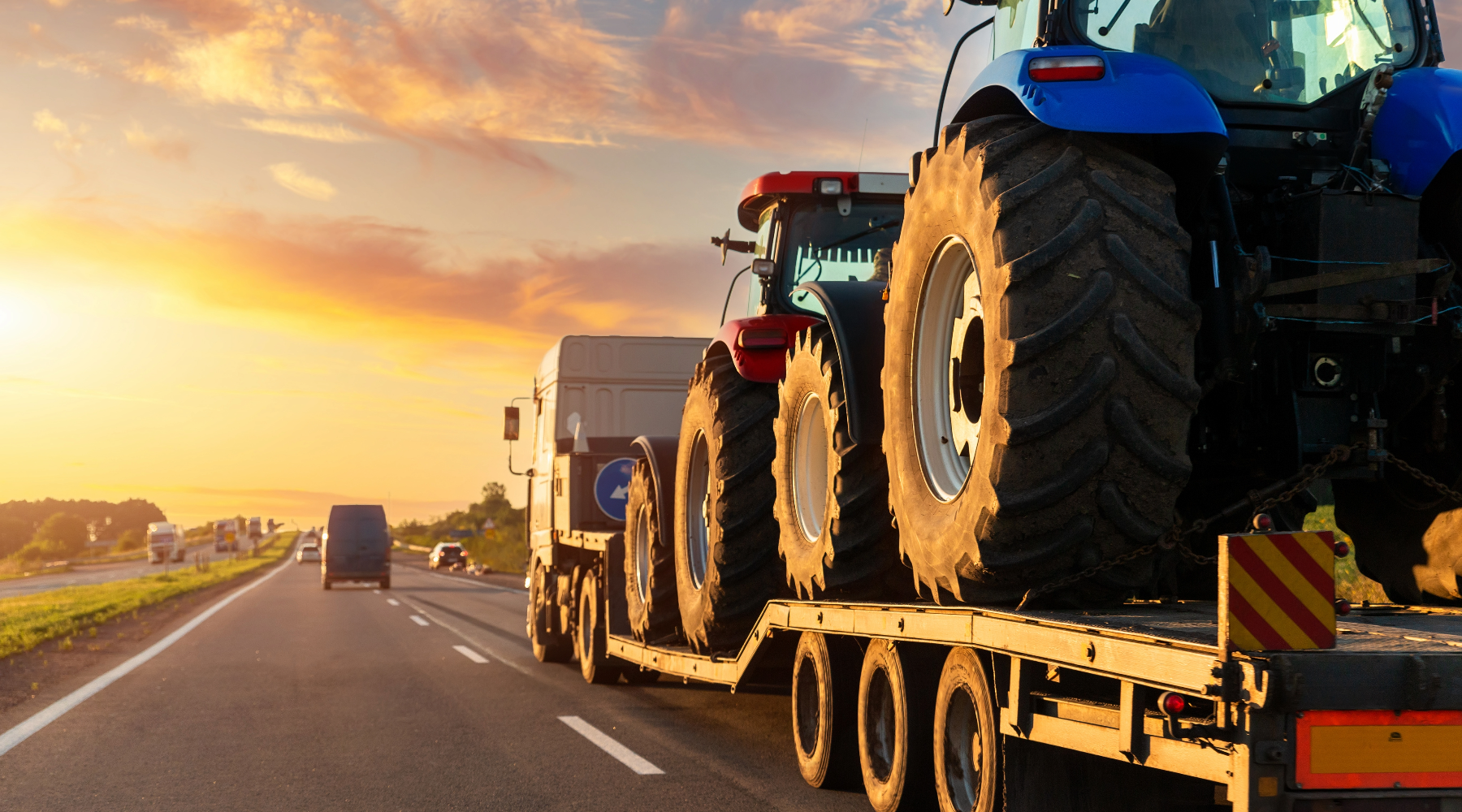 Oversize truck transporting industrial vehicles